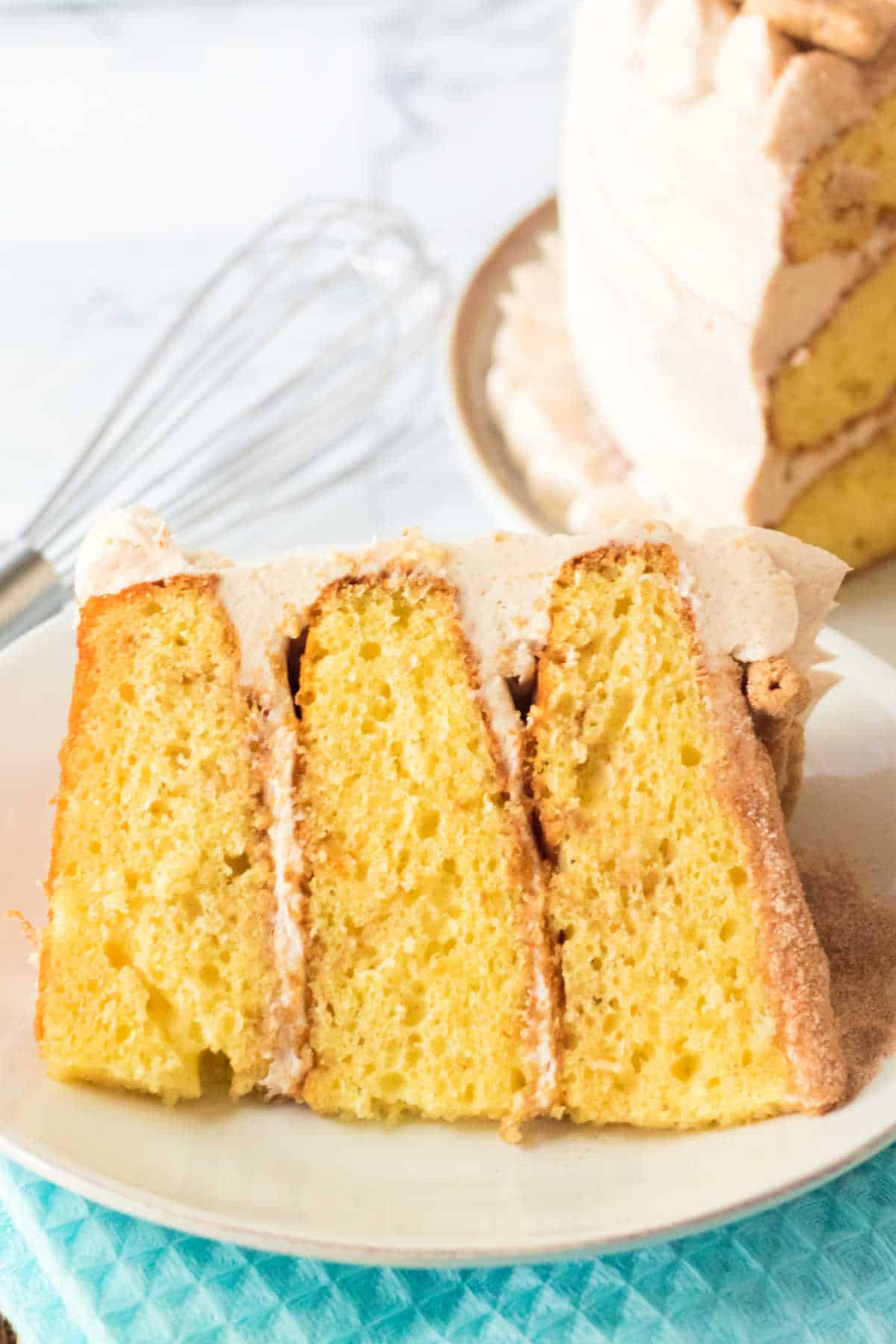 A slice of snickerdoodle cake on a plate.