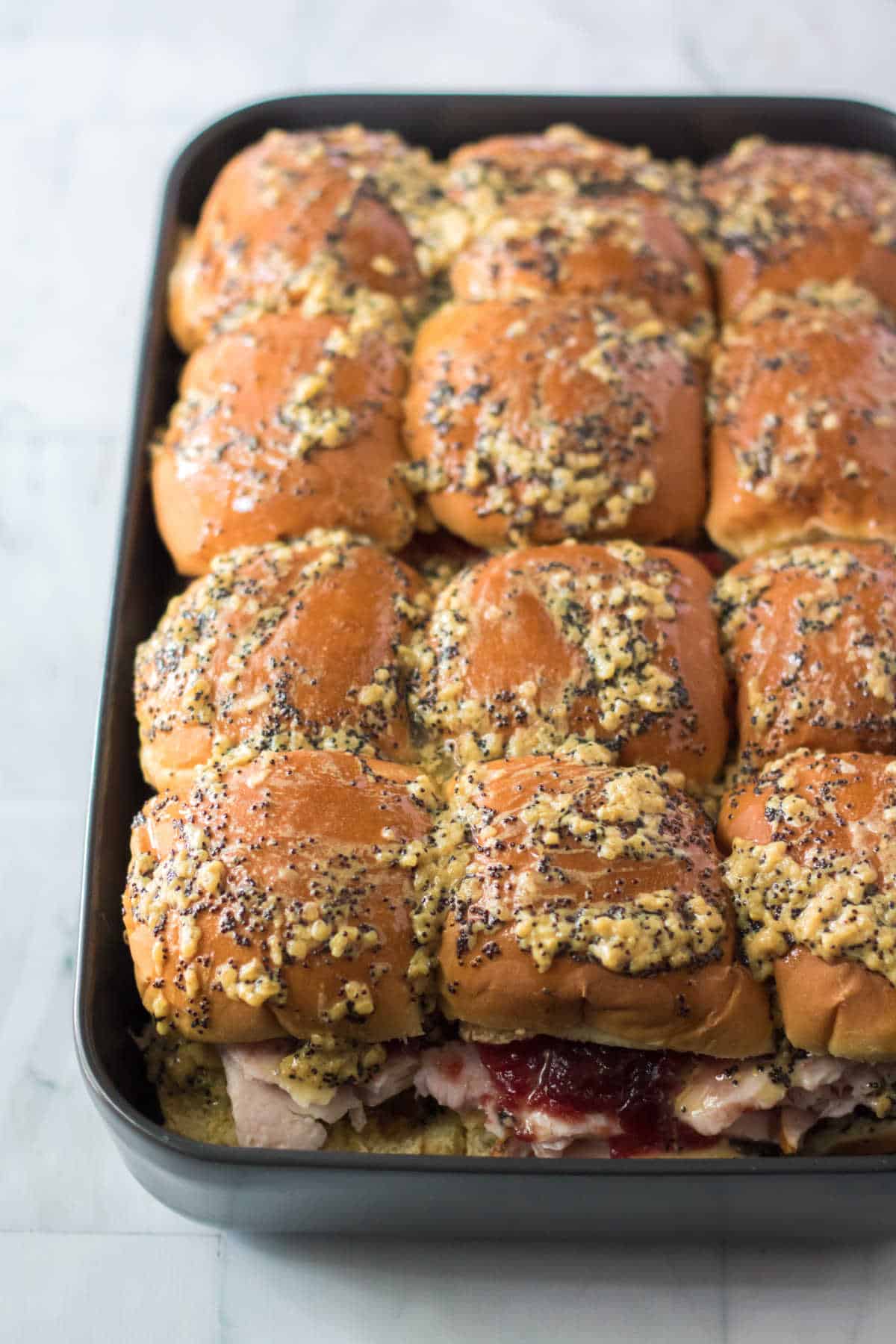 Thanksgiving sliders in a baking pan.