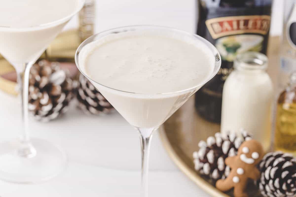 A gingerbread martini with holiday decor.