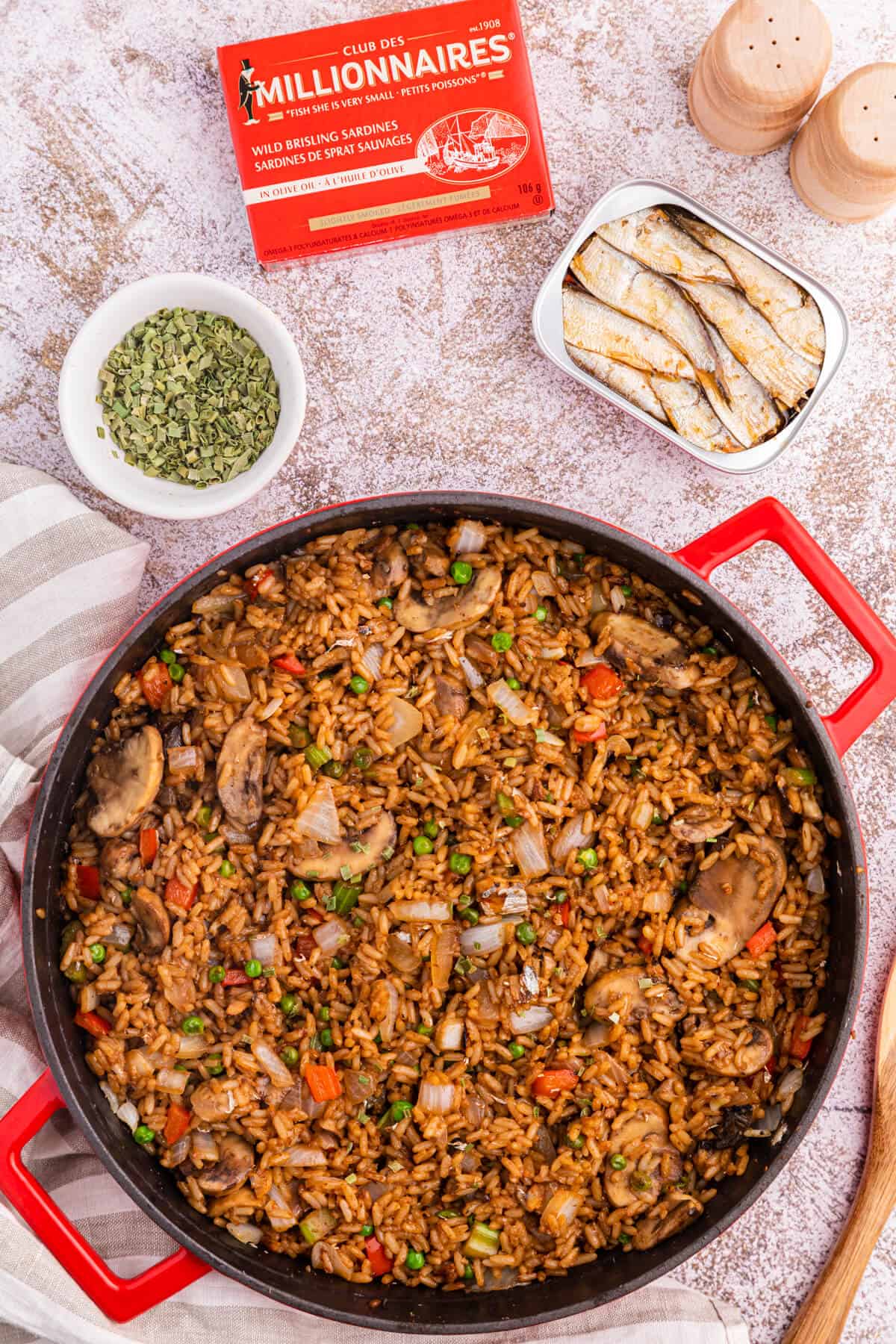 Sardine fried rice in a red skillet.
