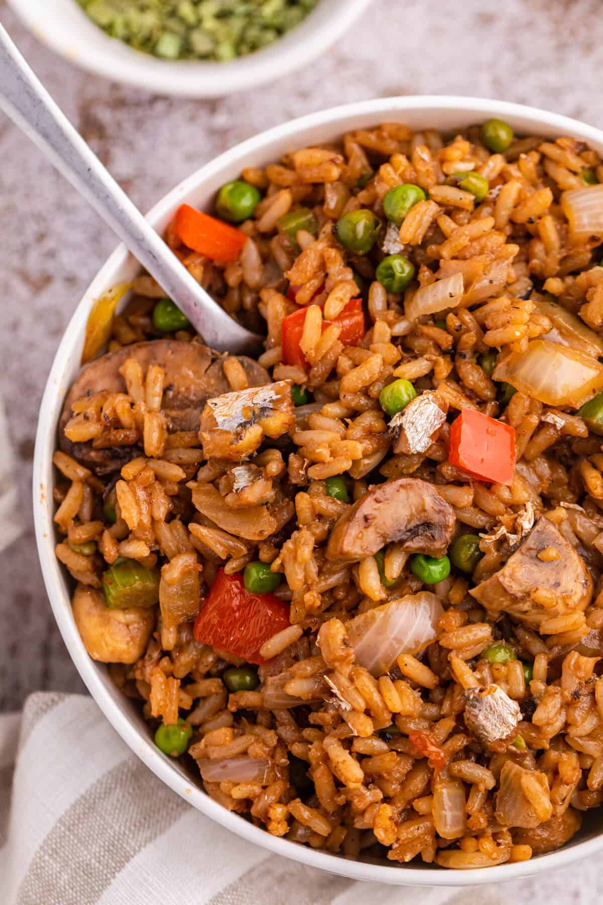 Sardine Fried Rice in a bowl with a spoon.