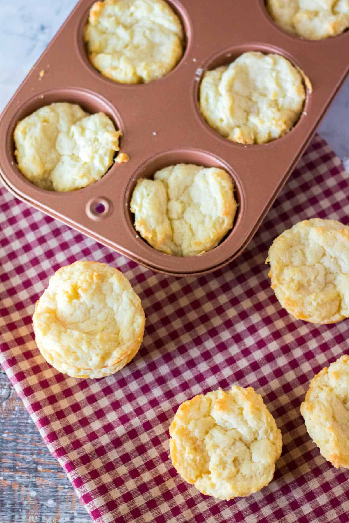 Sour cream biscuits in a muffin pan.