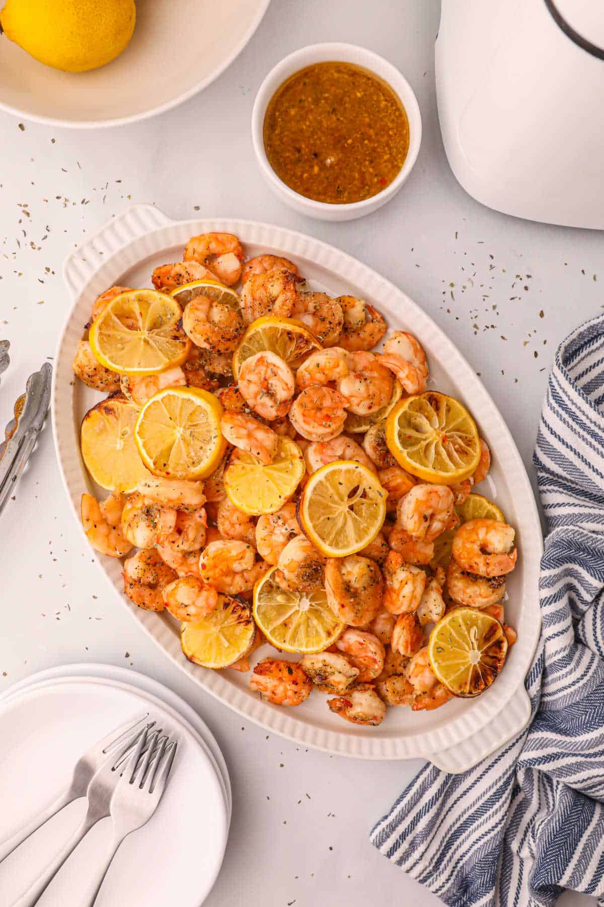 Air fryer shrimp on a white platter.