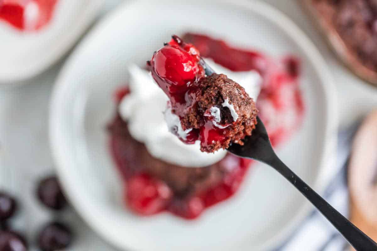 Black forest dump cake on a fork.