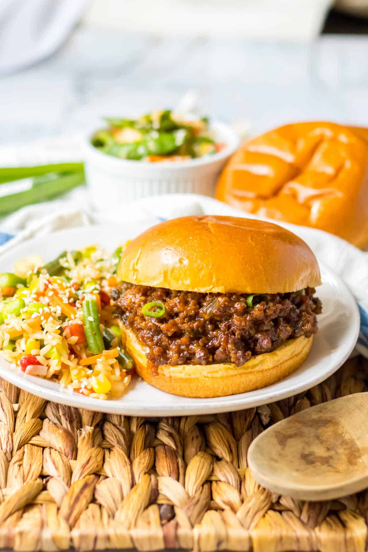 A plate with a Korean sloppy joe and veggie rice.