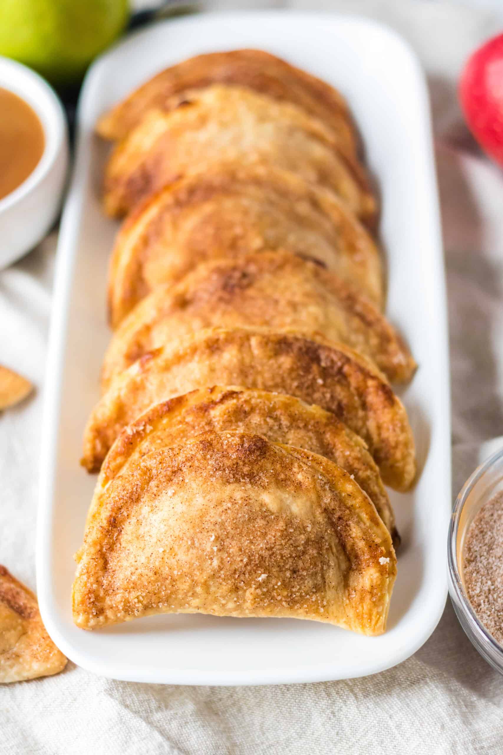 Copycat Taco Bell Air Fryer Caramel Apple Empanadas on a platter.