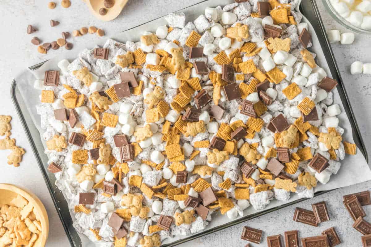 S'mores puppy chow on a baking sheet.