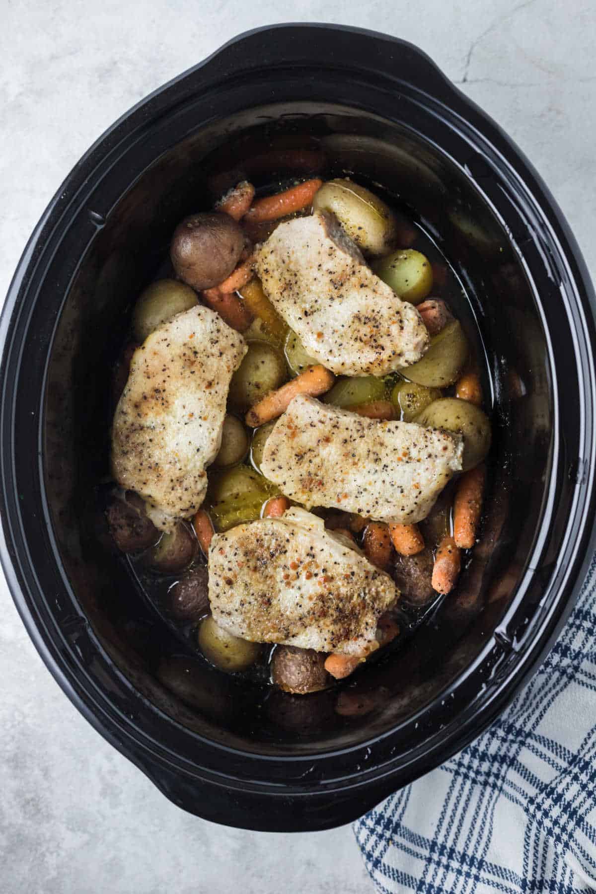 Italian pork chops and veggies in a Crockpot.