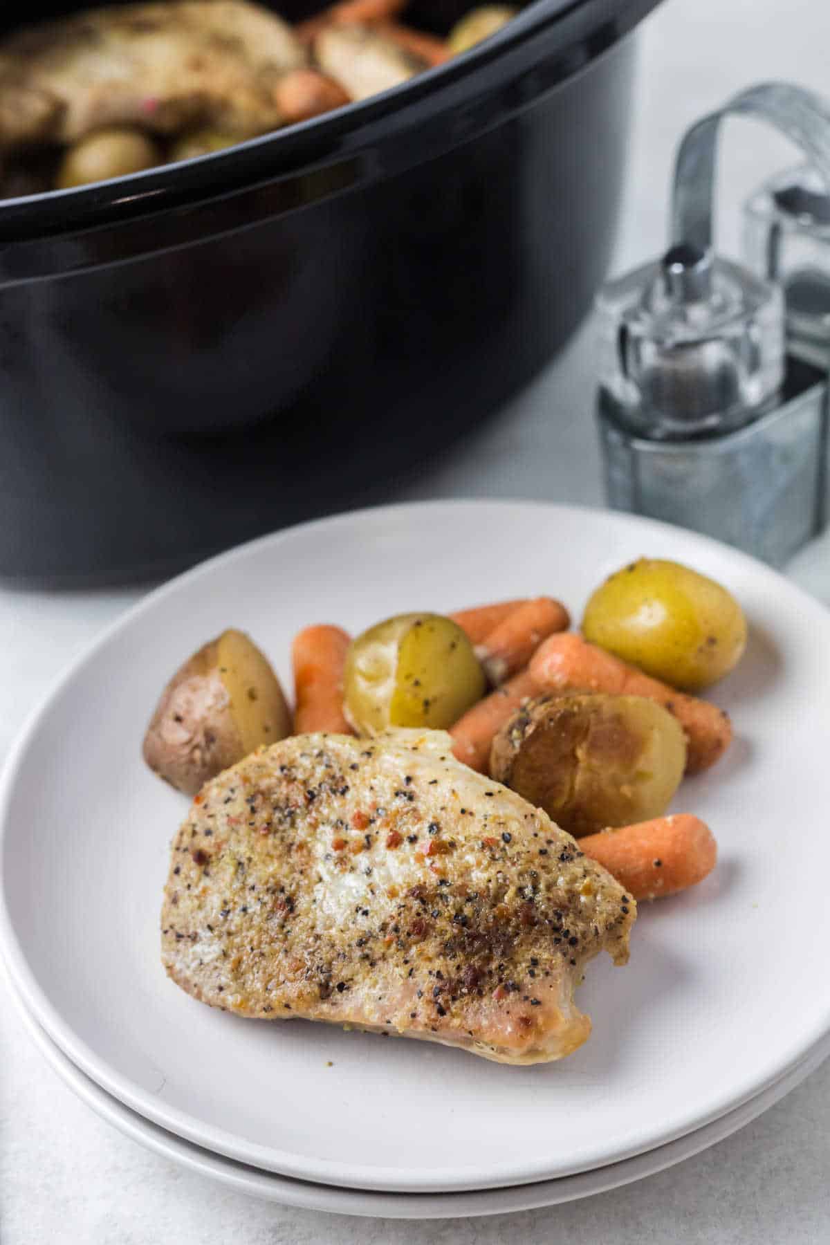 An Italian pork chop and veggies on a plate.