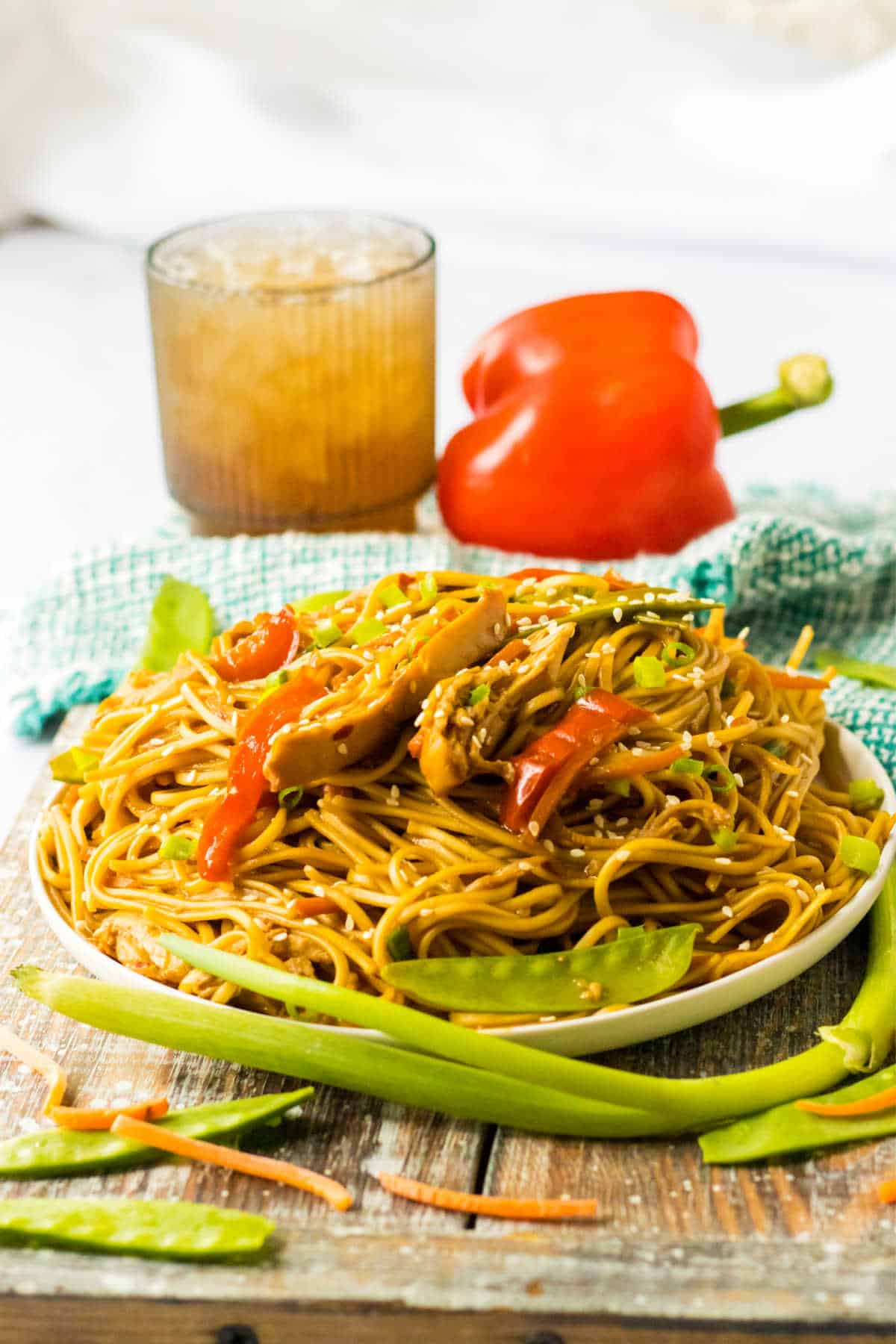 A plate of chicken lo mein.