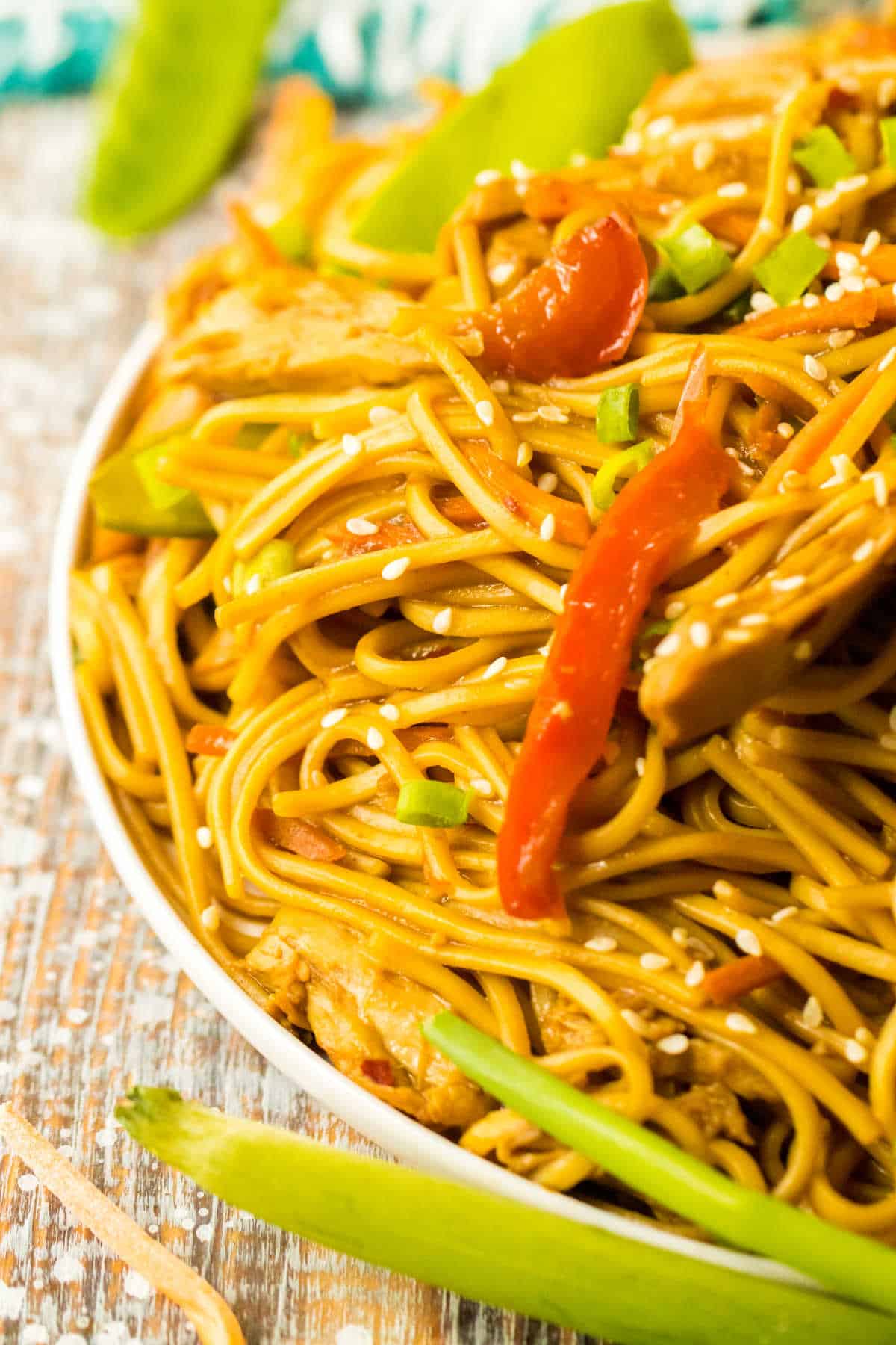 A plate of chicken lo mein.