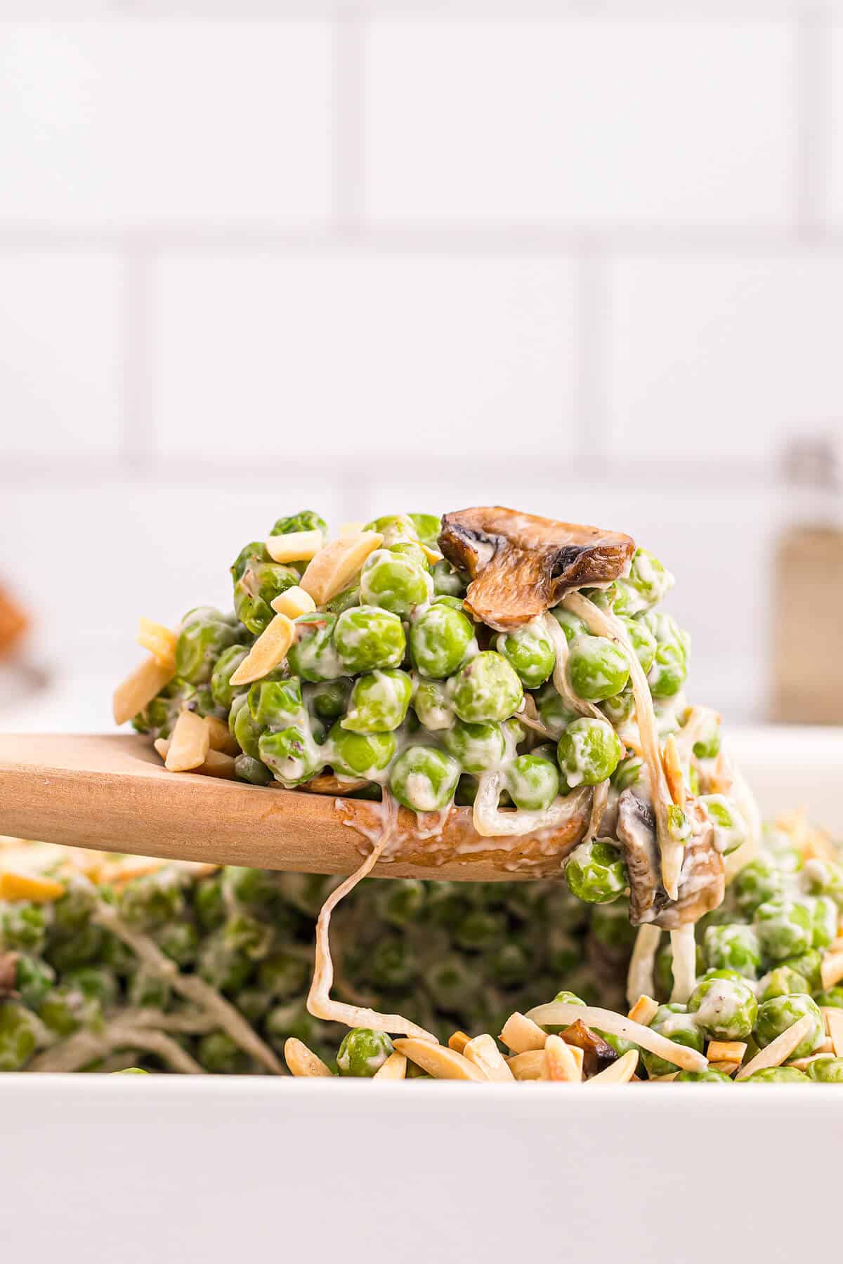 Company peas on a serving spoon.