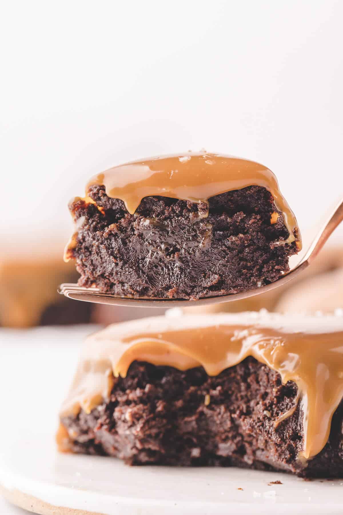 Salted caramel brownie lifted on a fork.