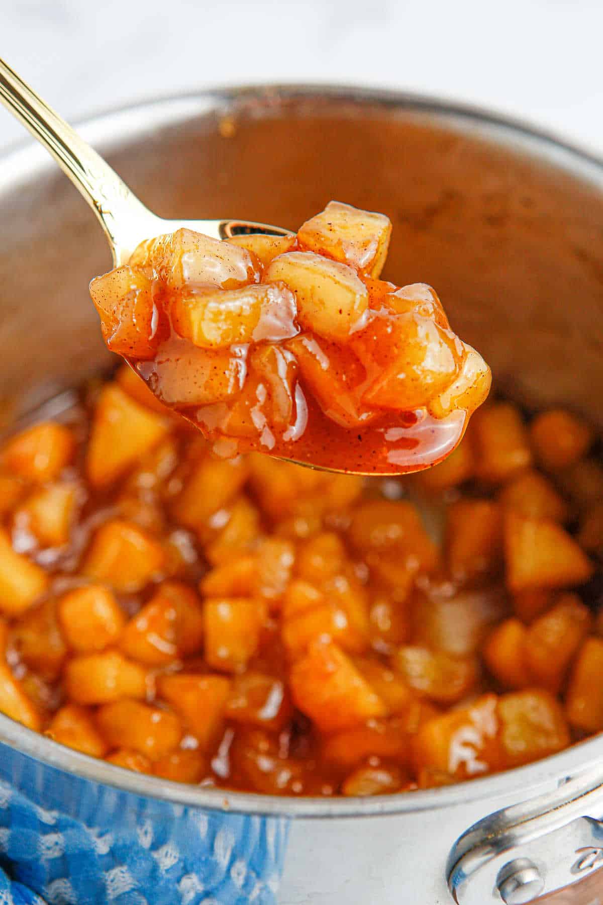 Apple compote on a spoon.