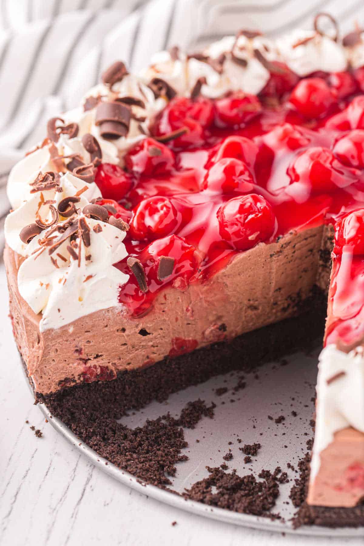 Black Forest Cheesecake with a slice removed.