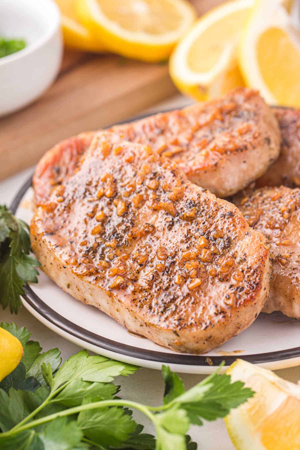 Honey garlic pork chops on a plate.