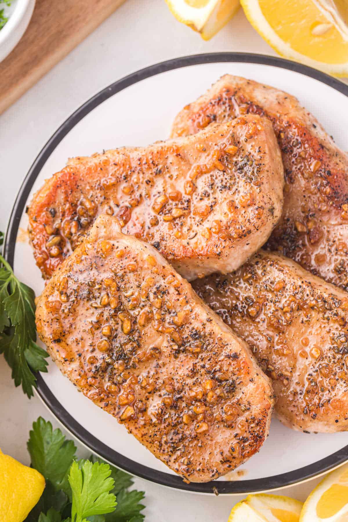 Honey garlic pork chops on a plate.