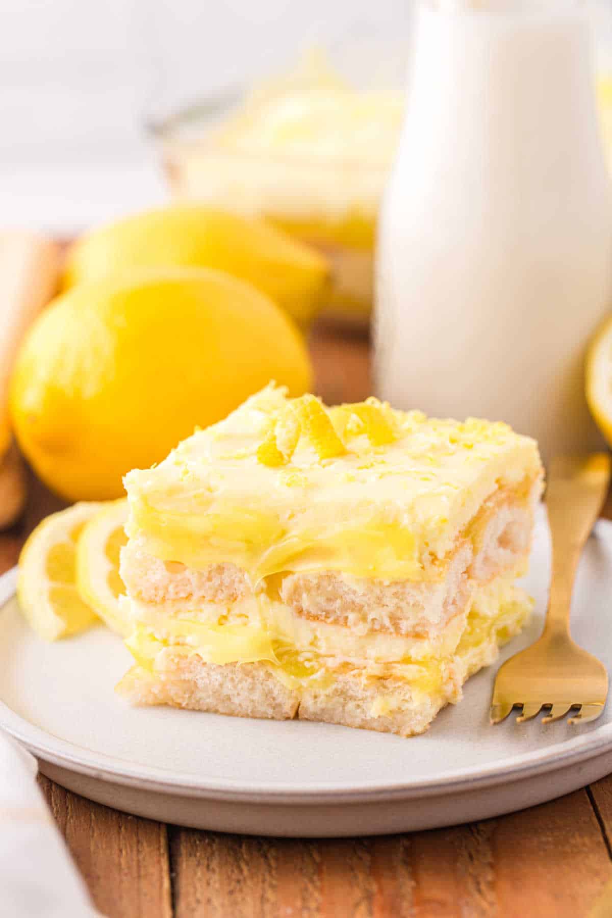 A piece of lemon tiramisu on a plate.