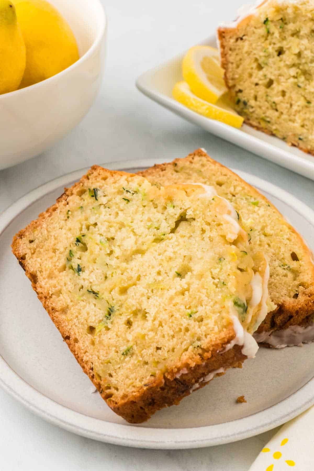 Slices of lemon zucchini bread on a plate.