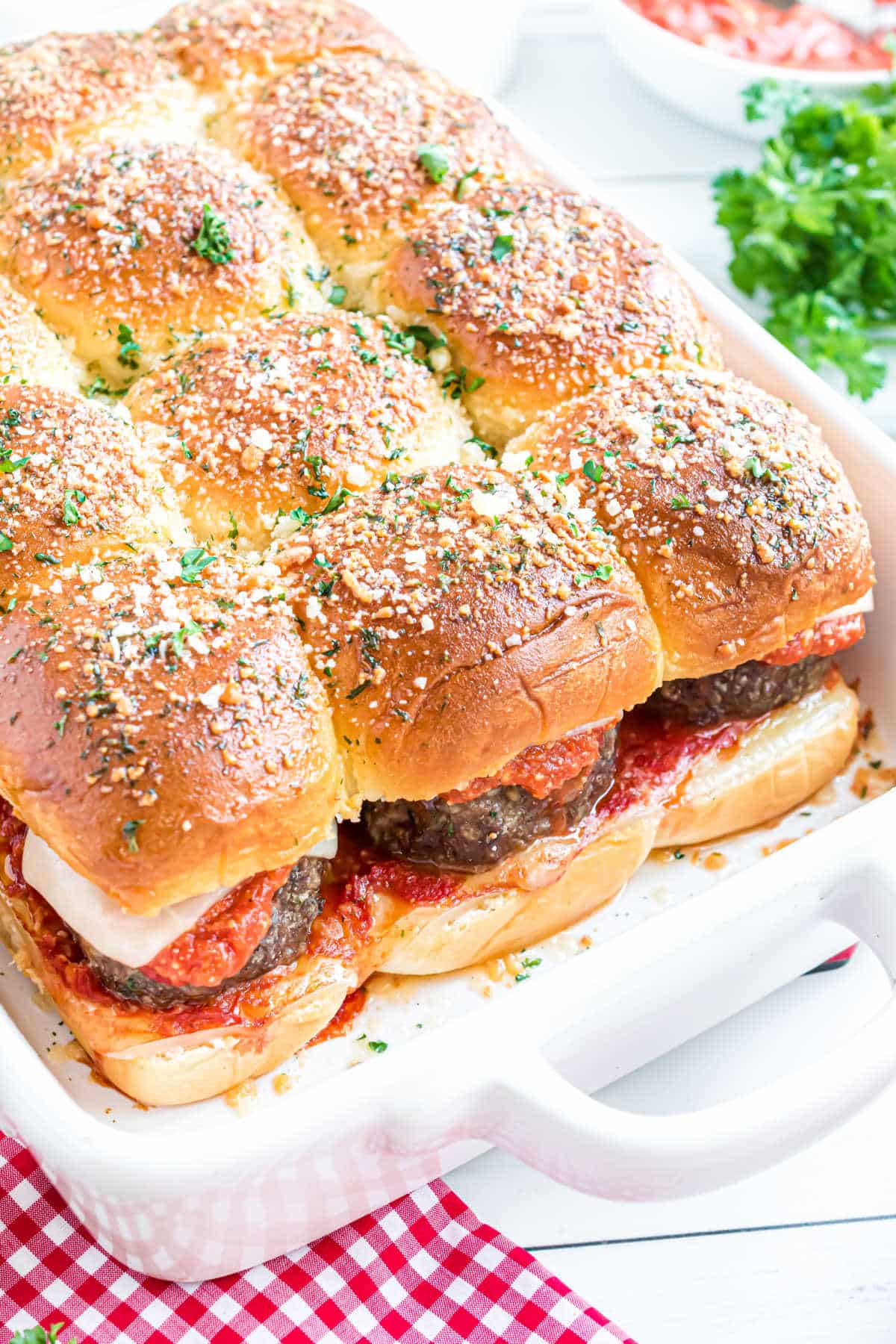 Meatball sliders in a white pan.