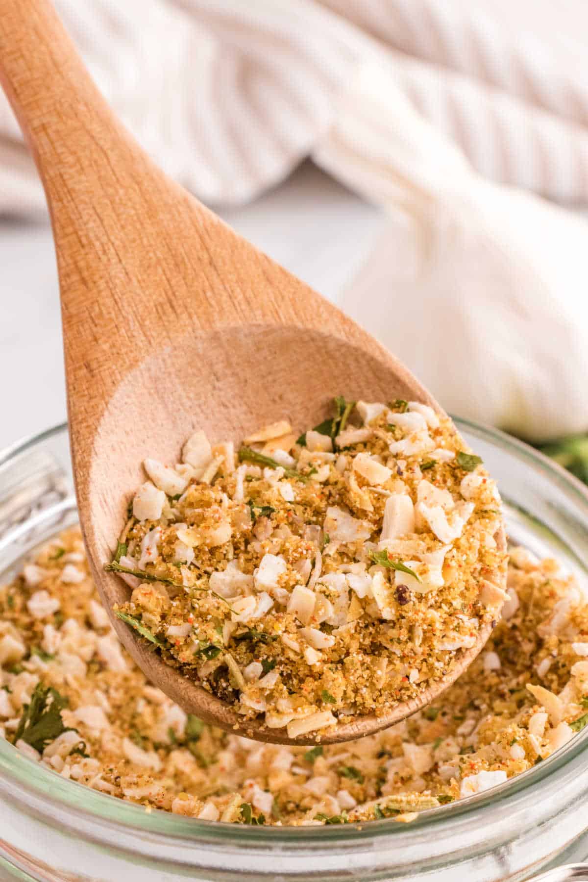 Onion soup mix on a wooden spoon.