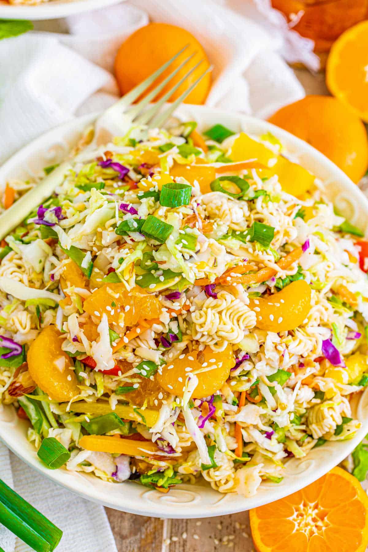 Ramen noodle salad on a plate with a fork.