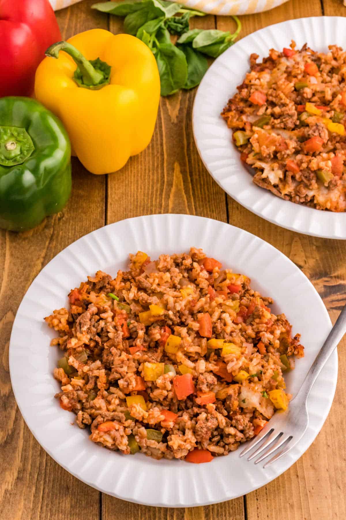 Stuffed pepper casserole on a plate with a fork.