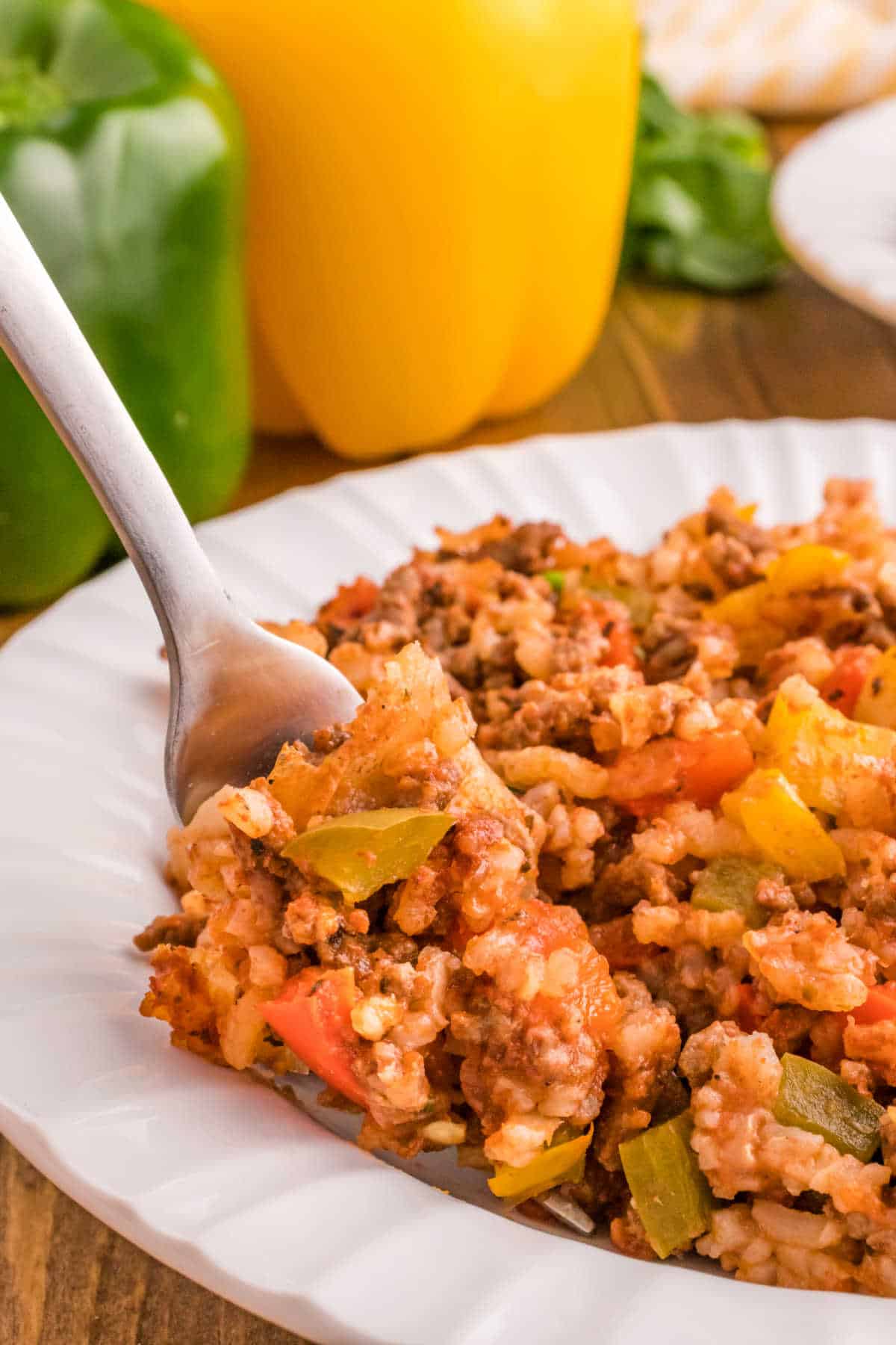 Stuffed pepper casserole on a plate with a fork.