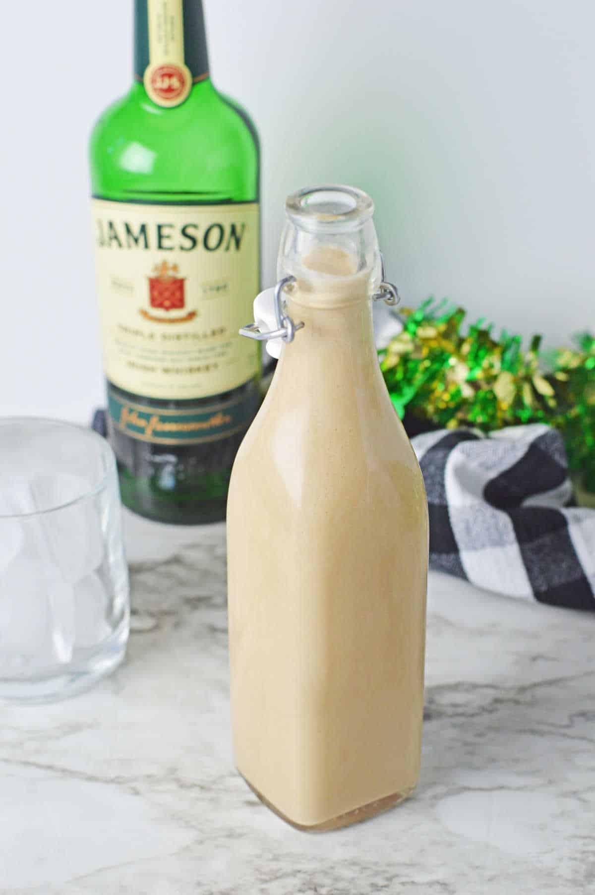 Homemade Irish Cream in a glass bottle.