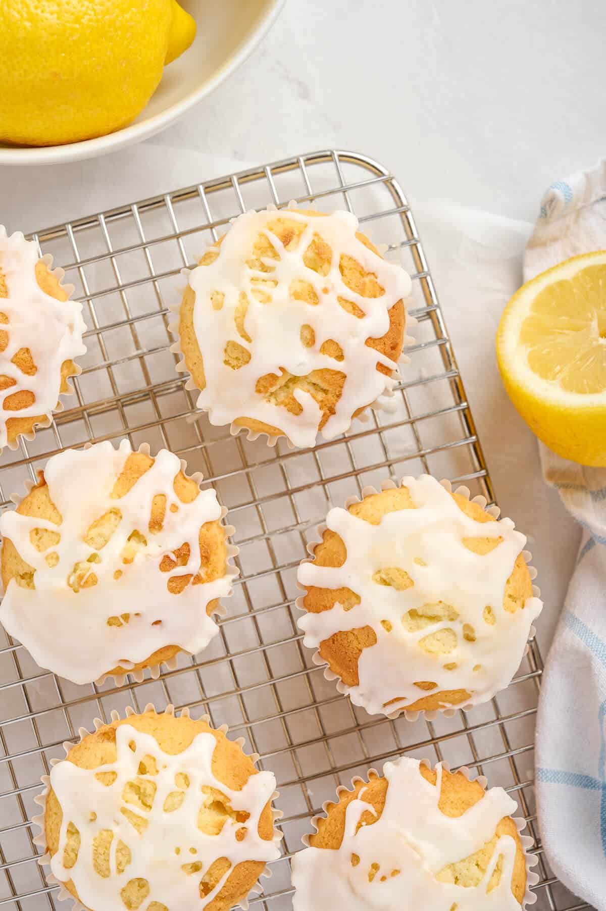 Lemon pound cake muffins on a wire rack.