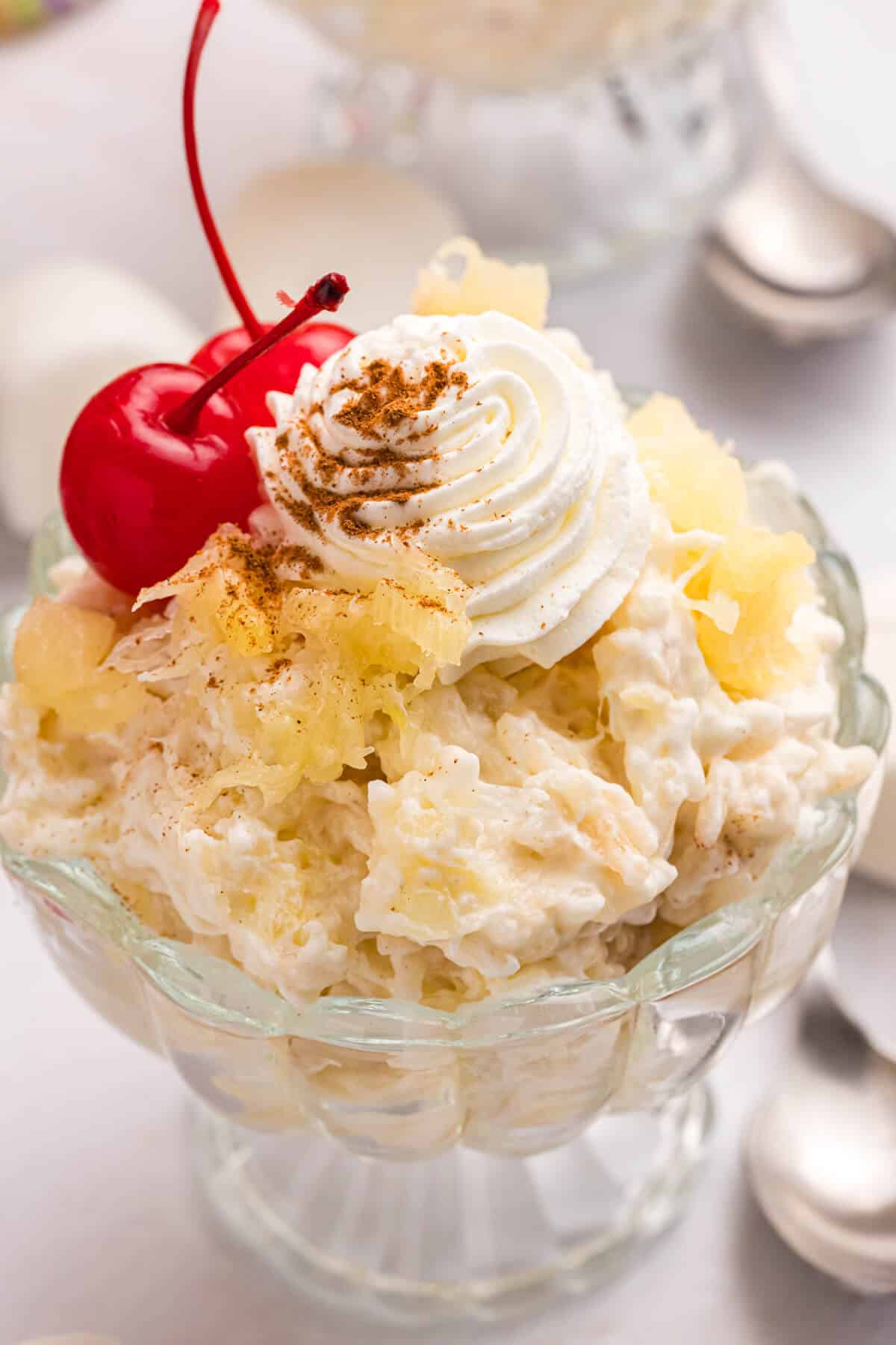 Pineapple rice pudding in a parfait dish.