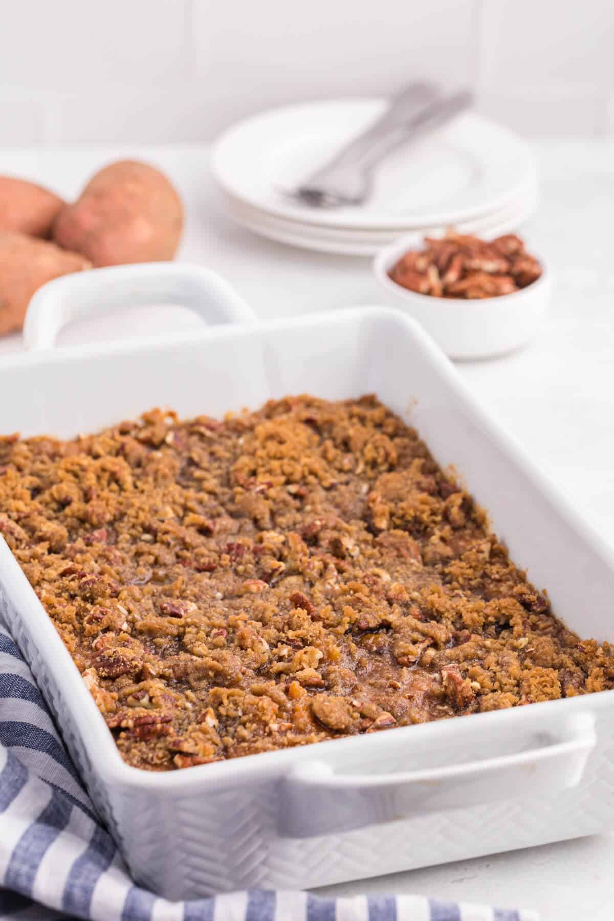 Sweet potato casserole in a white casserole pan.