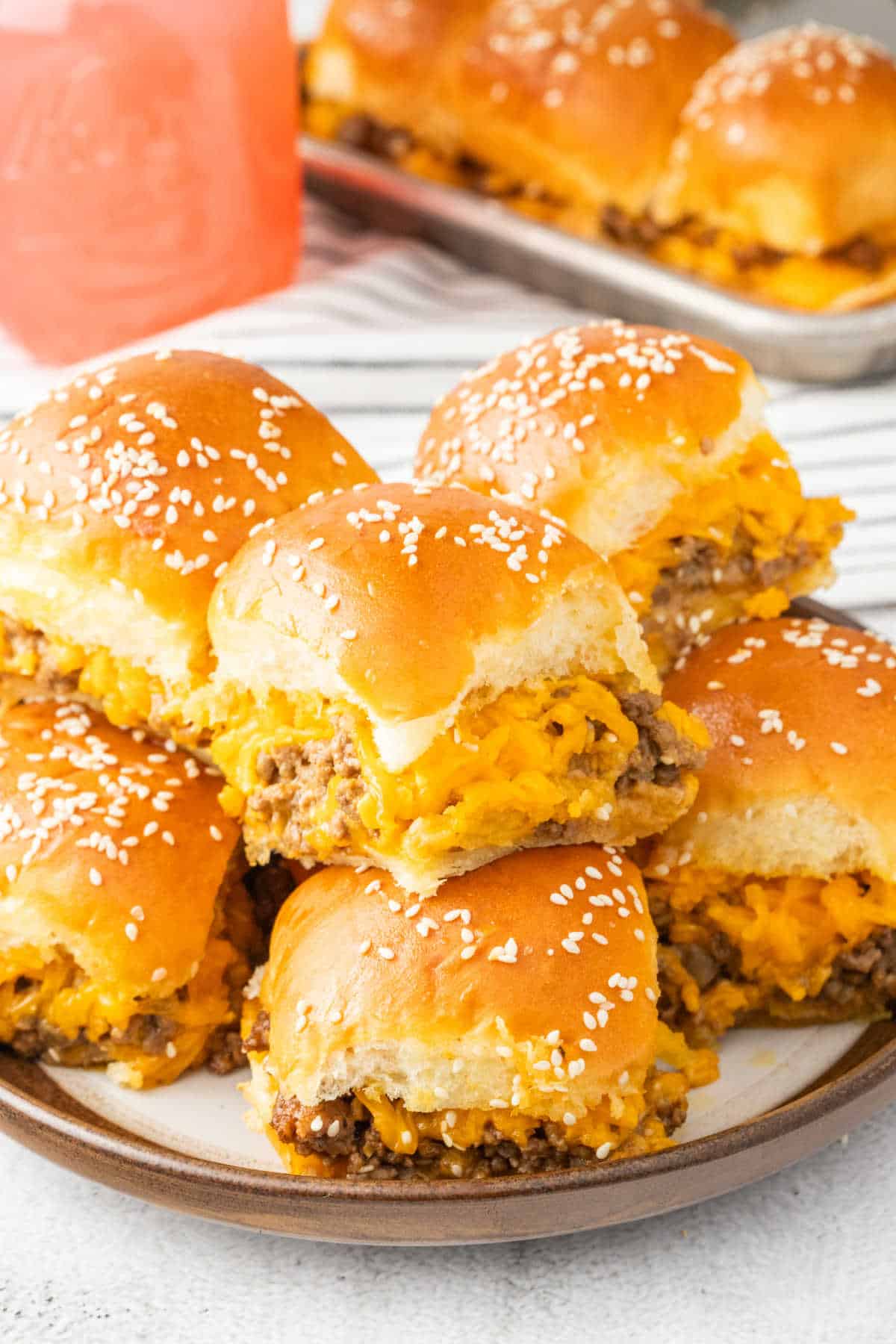 Cheeseburger sliders on a plate.