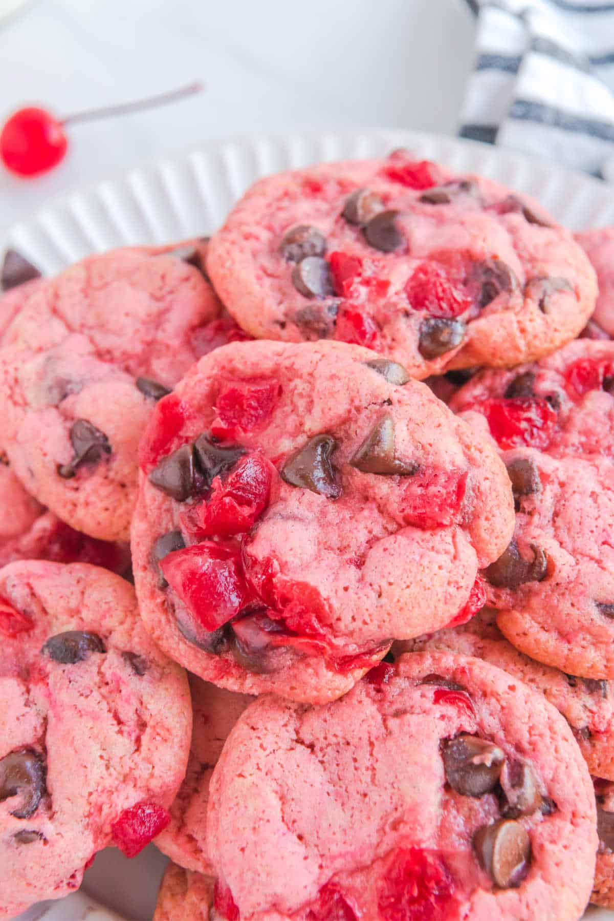 Cherry cookies piled together.