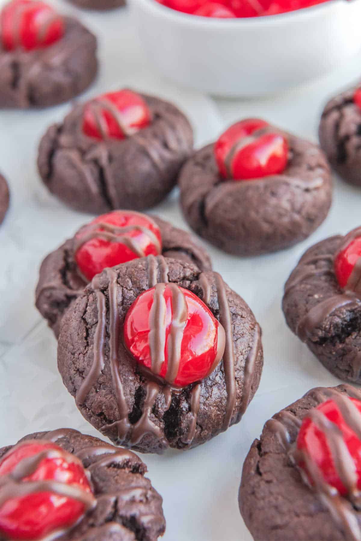 A group of chocolate cherry cookies.