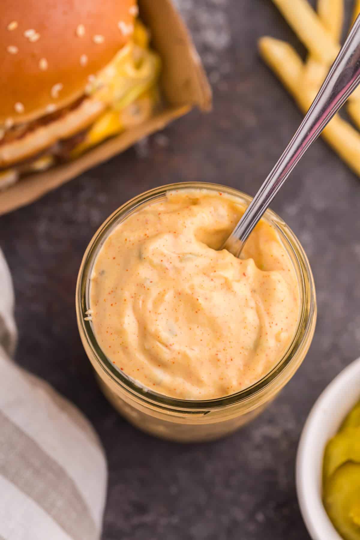 Big mac sauce in a jar with a spoon.
