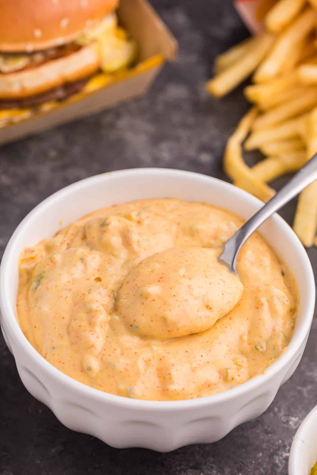 Big mac sauce in a bowl with a spoon.