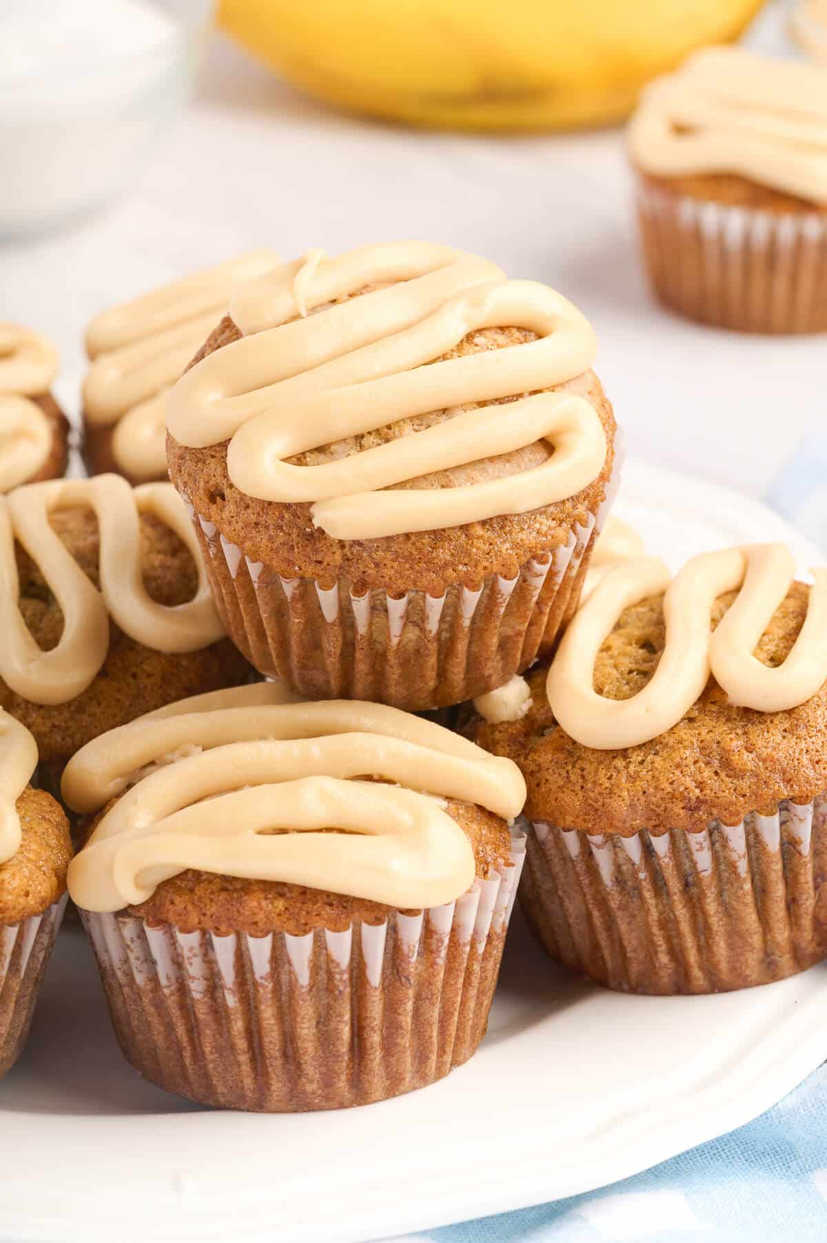 A pile of muffins on a plate.