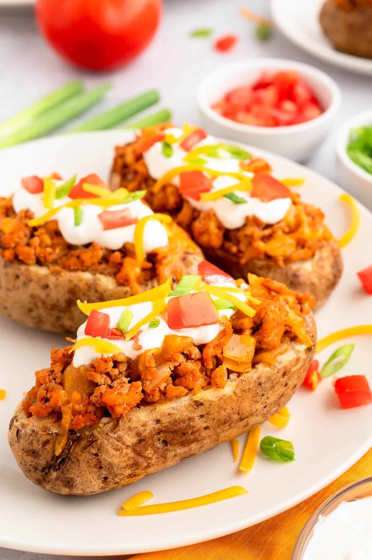 Chicken taco twice-baked potatoes on a plate.