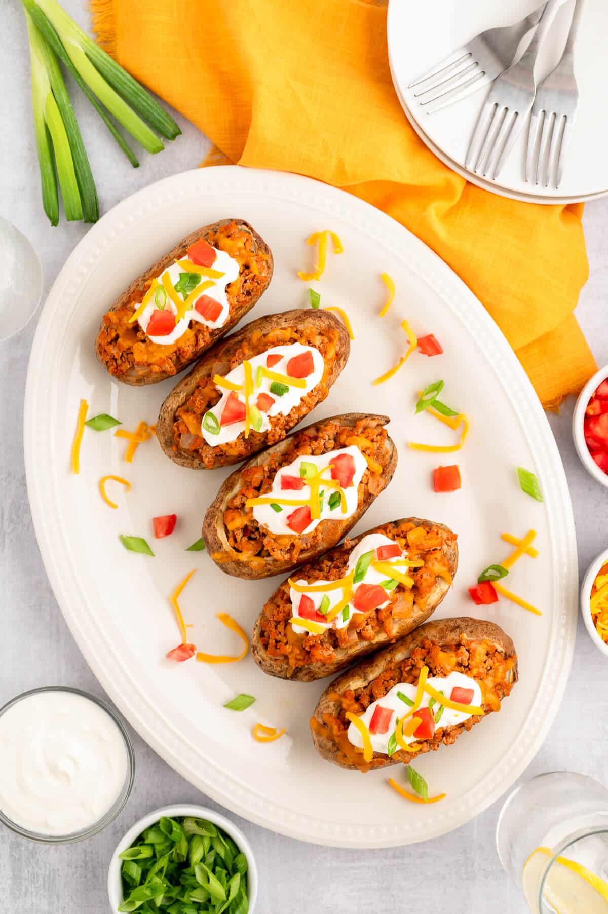 Chicken taco twice-baked potatoes on a platter.