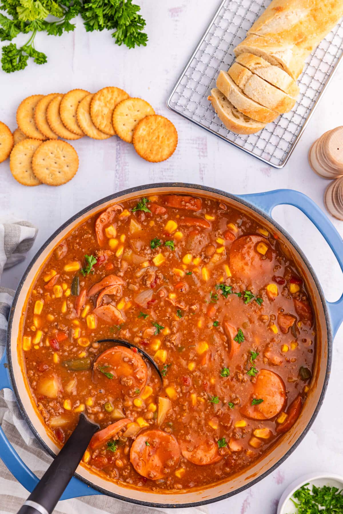 Cowboy stew in a pot with a ladle.