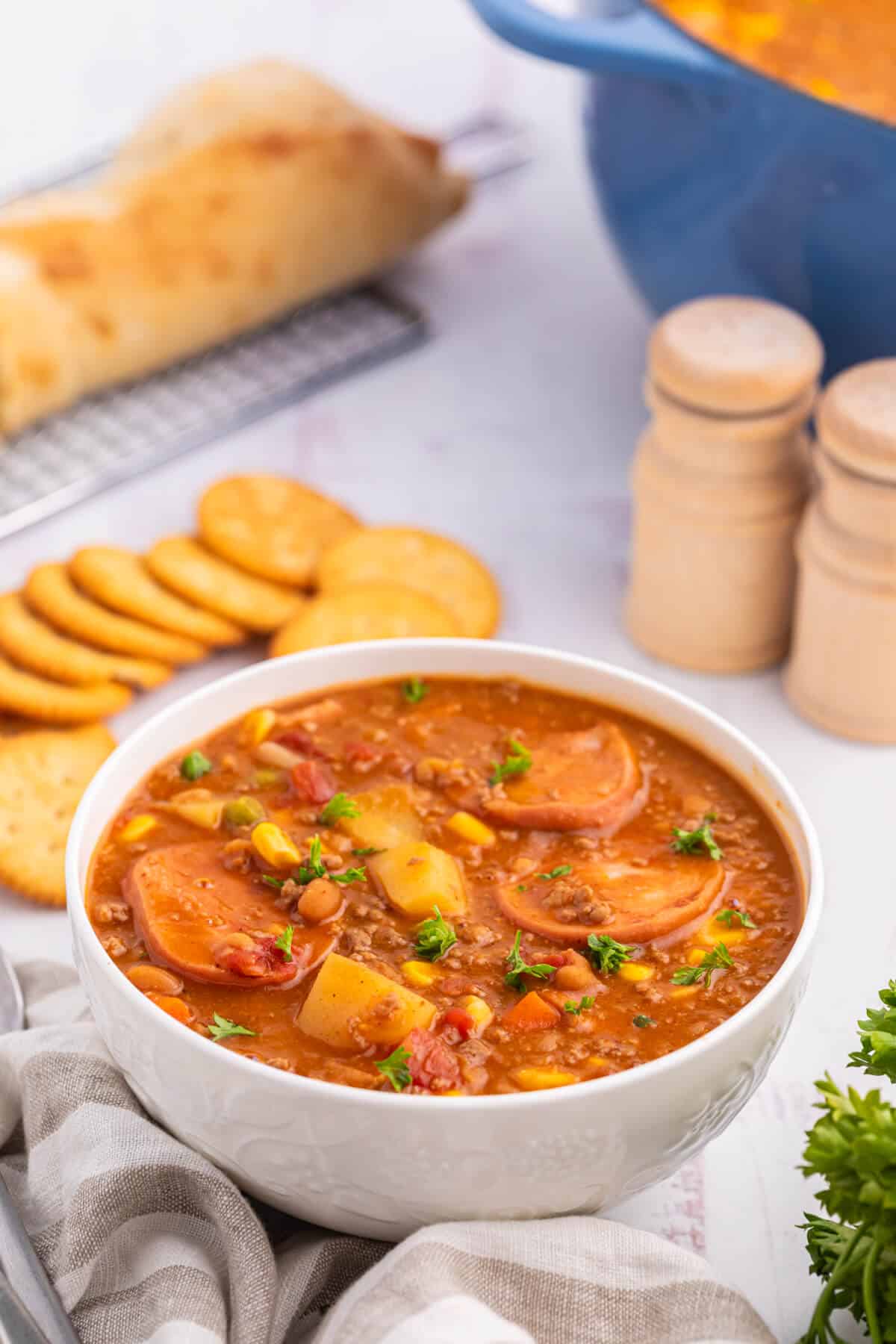 Cowboy stew in a white bowl.