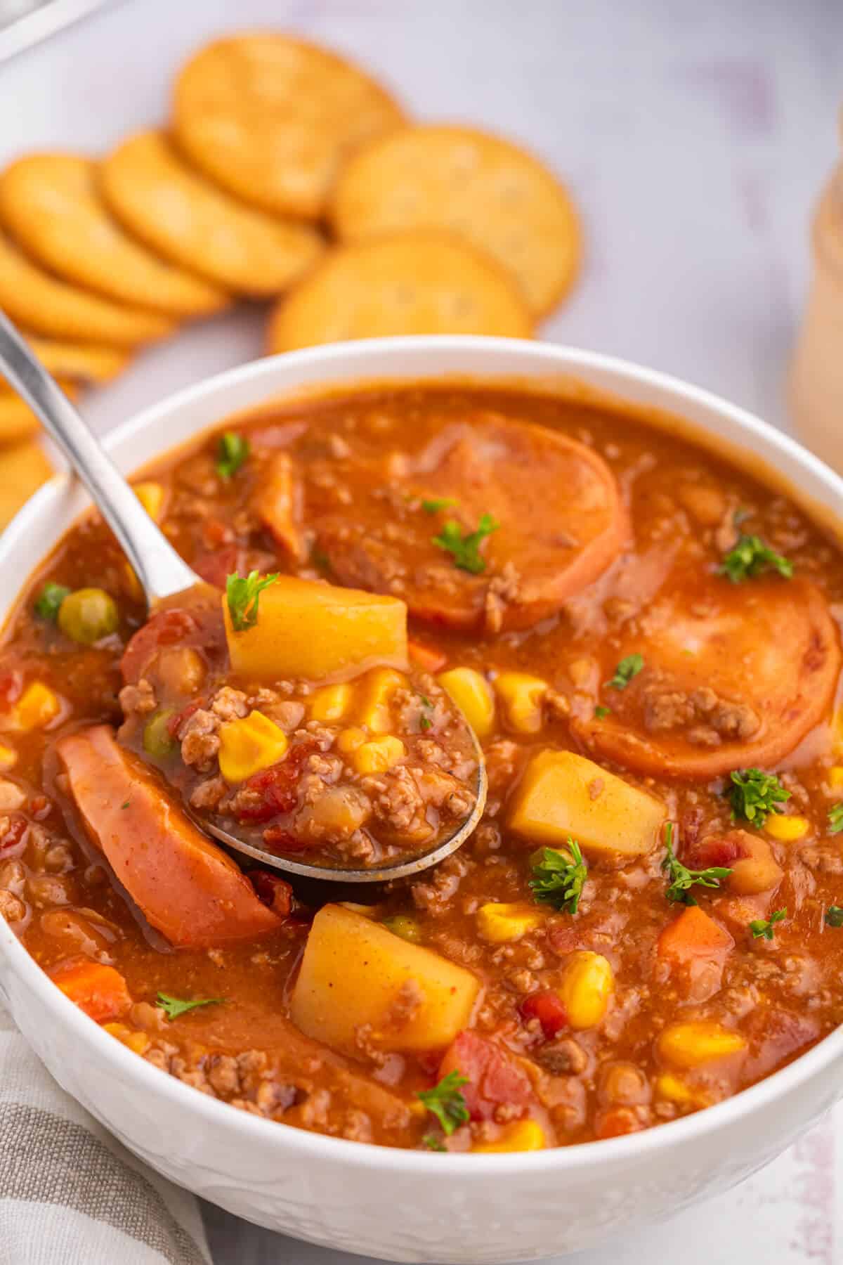 Cowboy stew in a bowl with a spoon.