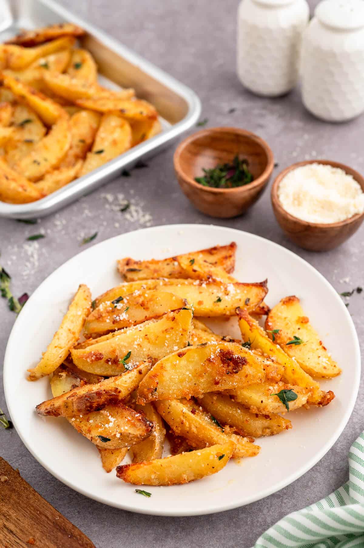 Parmesan thyme roasted potatoes on a plate.