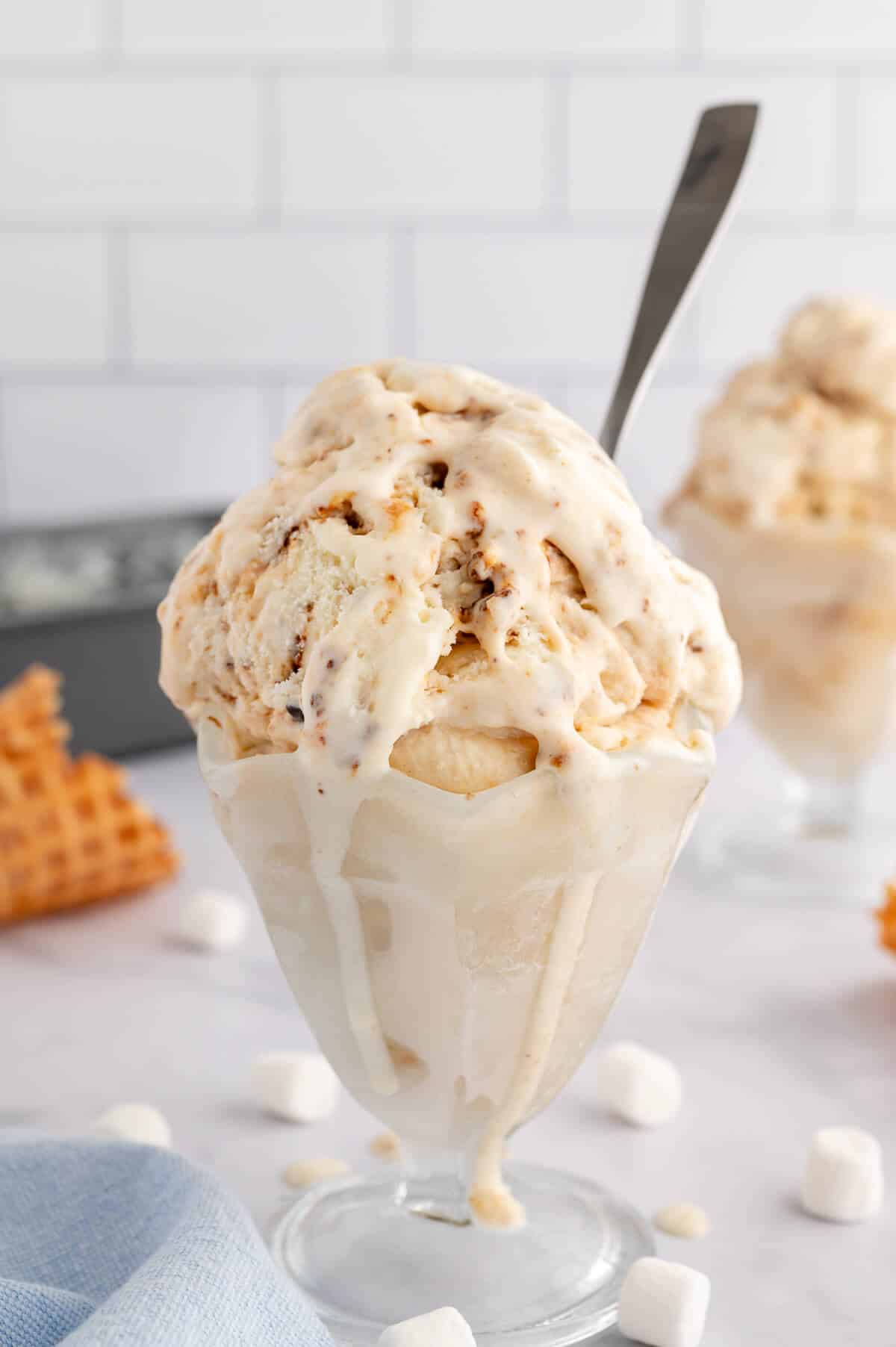 Toasted Marshmallow Ice Cream in a glass ice cream dish with a spoon