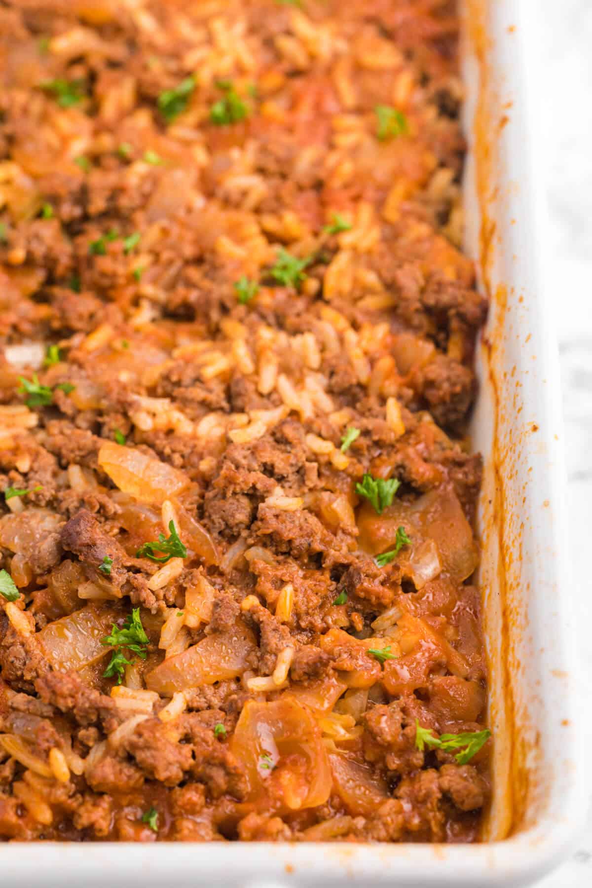 The recipe in a white casserole dish.