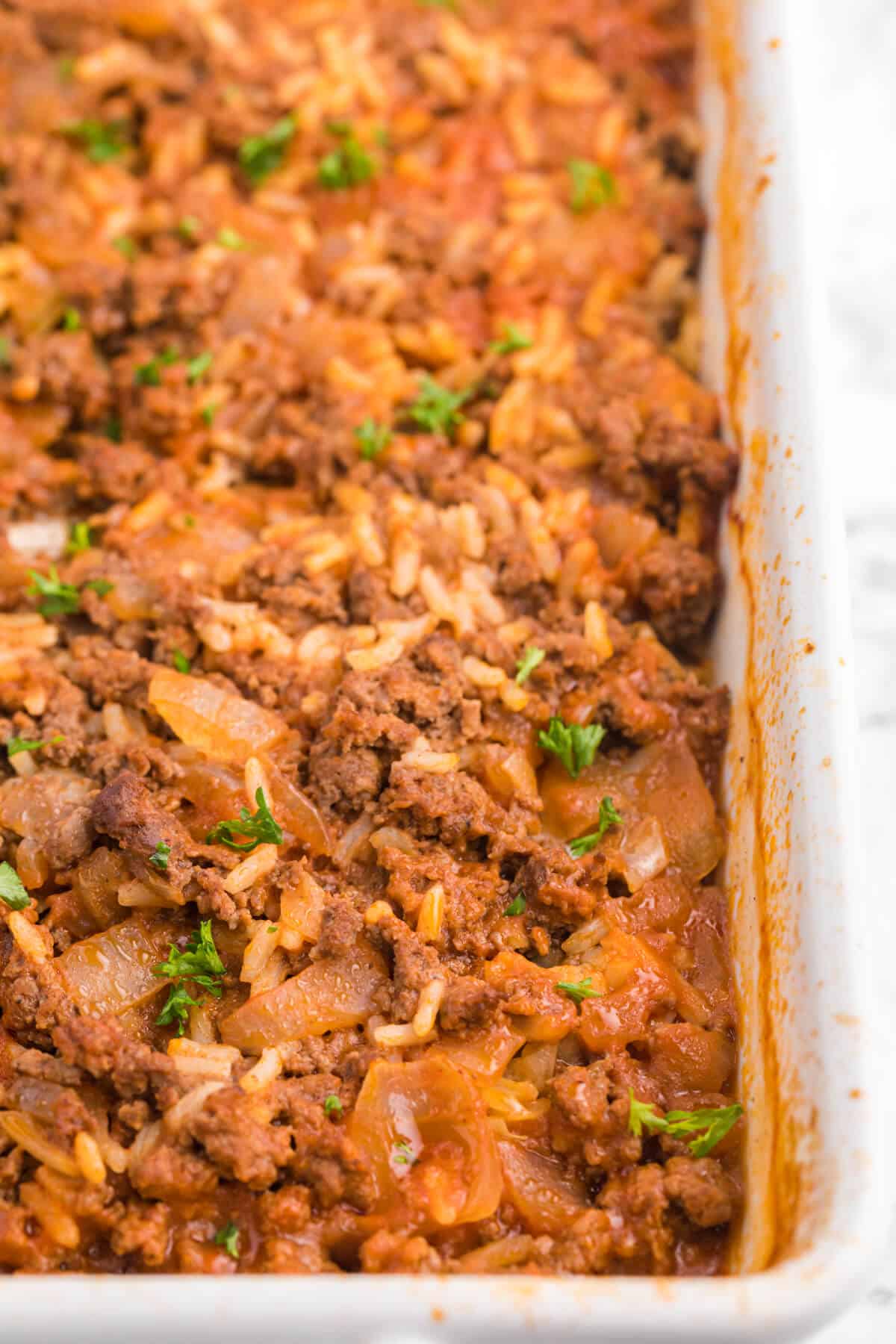 Cabbage roll casserole in a white casserole dish.