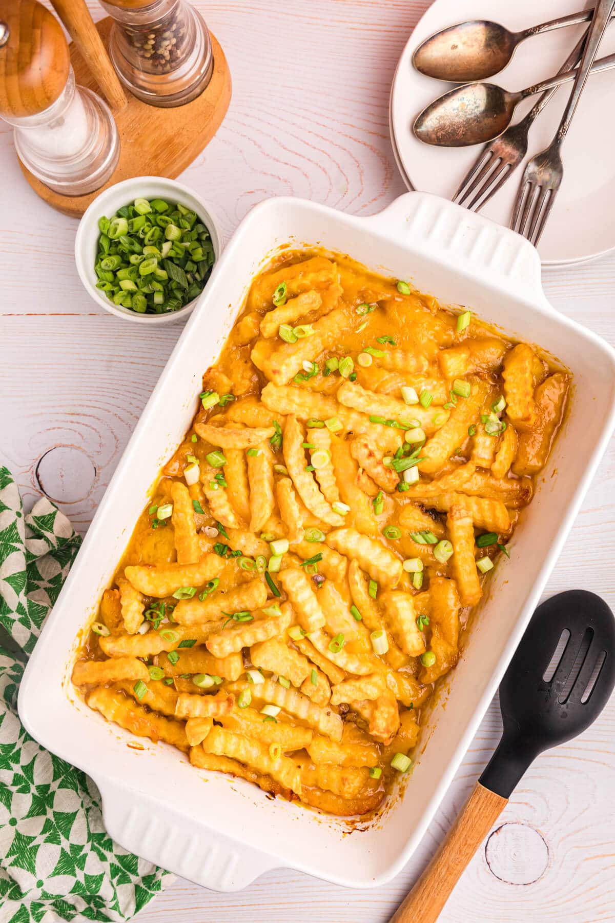 French fry casserole in a white pan.