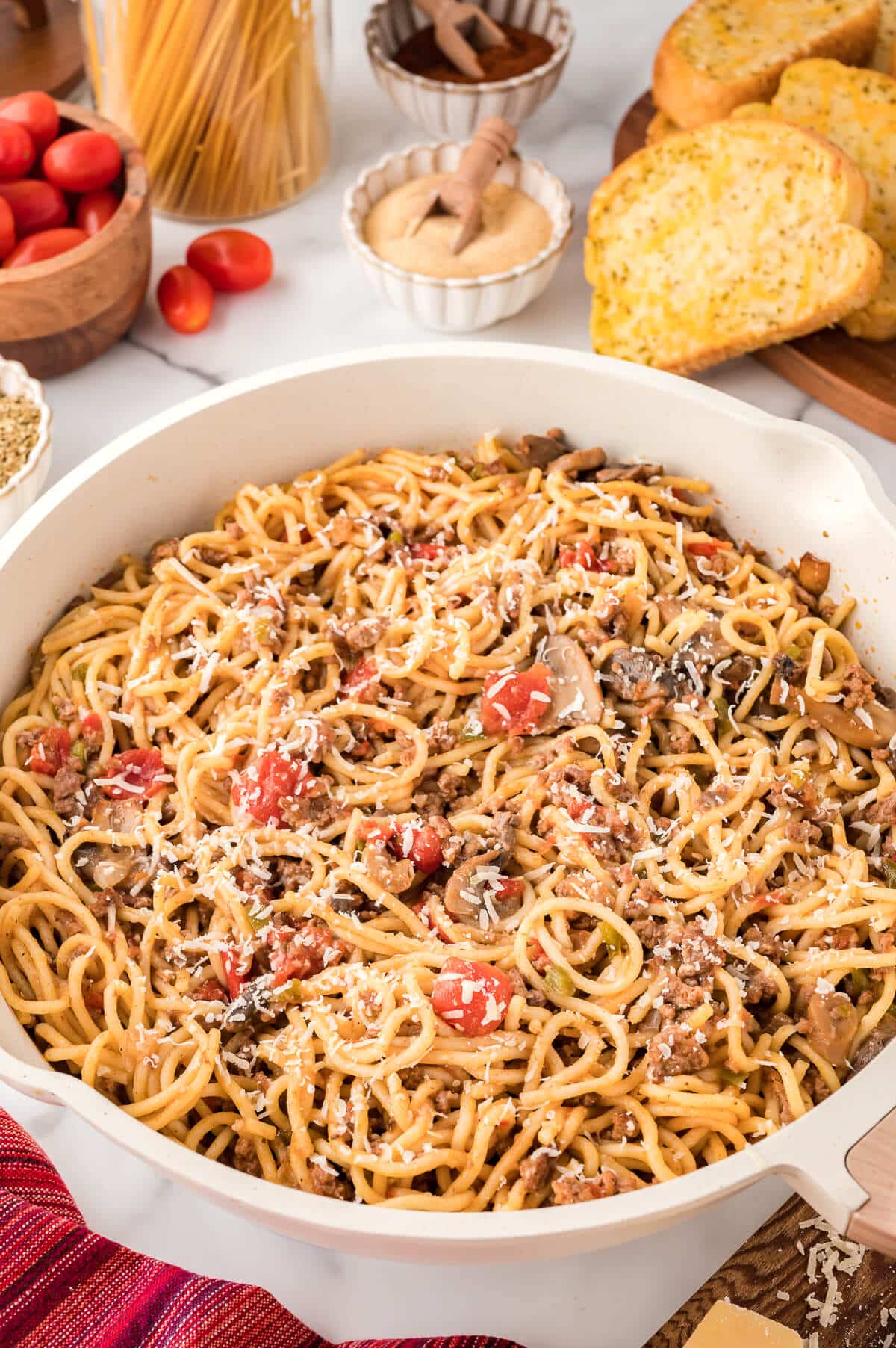 Spaghetti in a white pan.