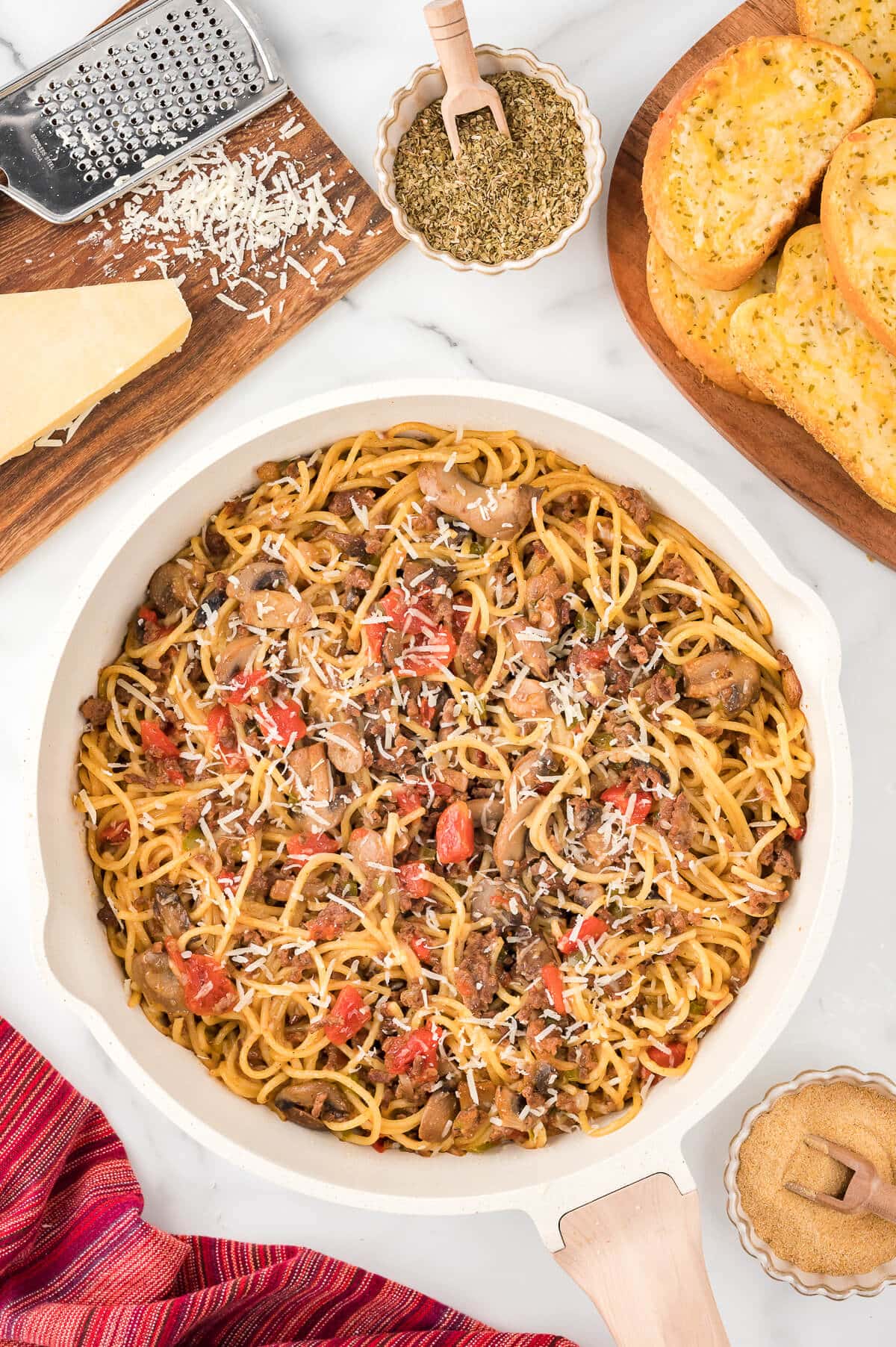 Spaghetti in a white pan.
